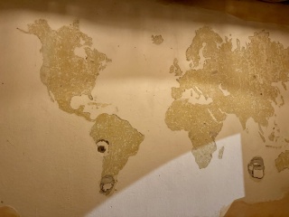 Chipped stucco world map
