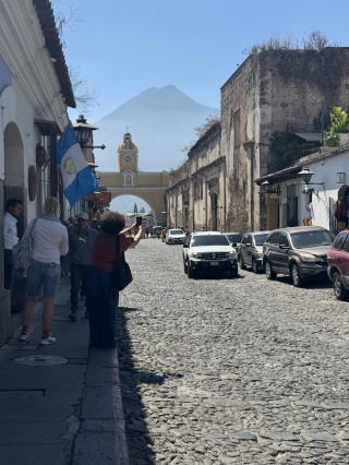 Us taking a photo of someone taking a photo of an arch